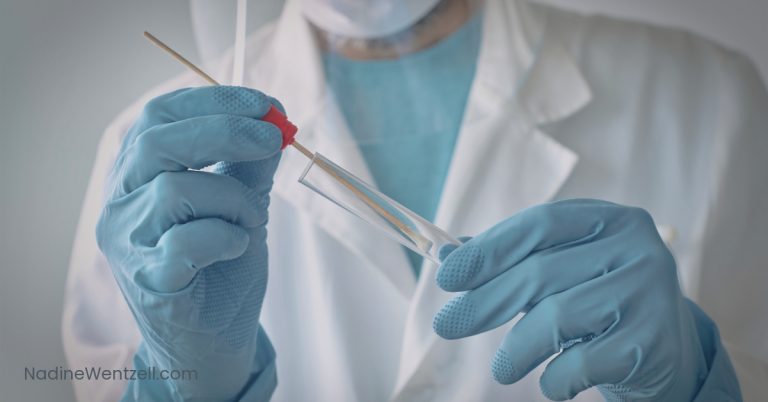 A close-up of a healthcare professional wearing a white lab coat and blue gloves, inserting a cotton swab into a transparent test tube, likely for oral fluid drug testing.